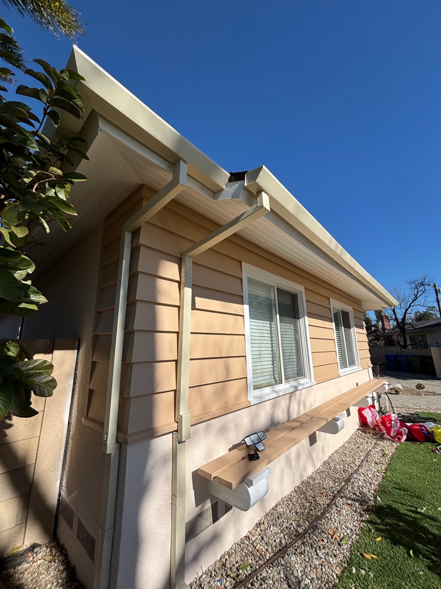 New gutters and downspouts on a ranch-style home